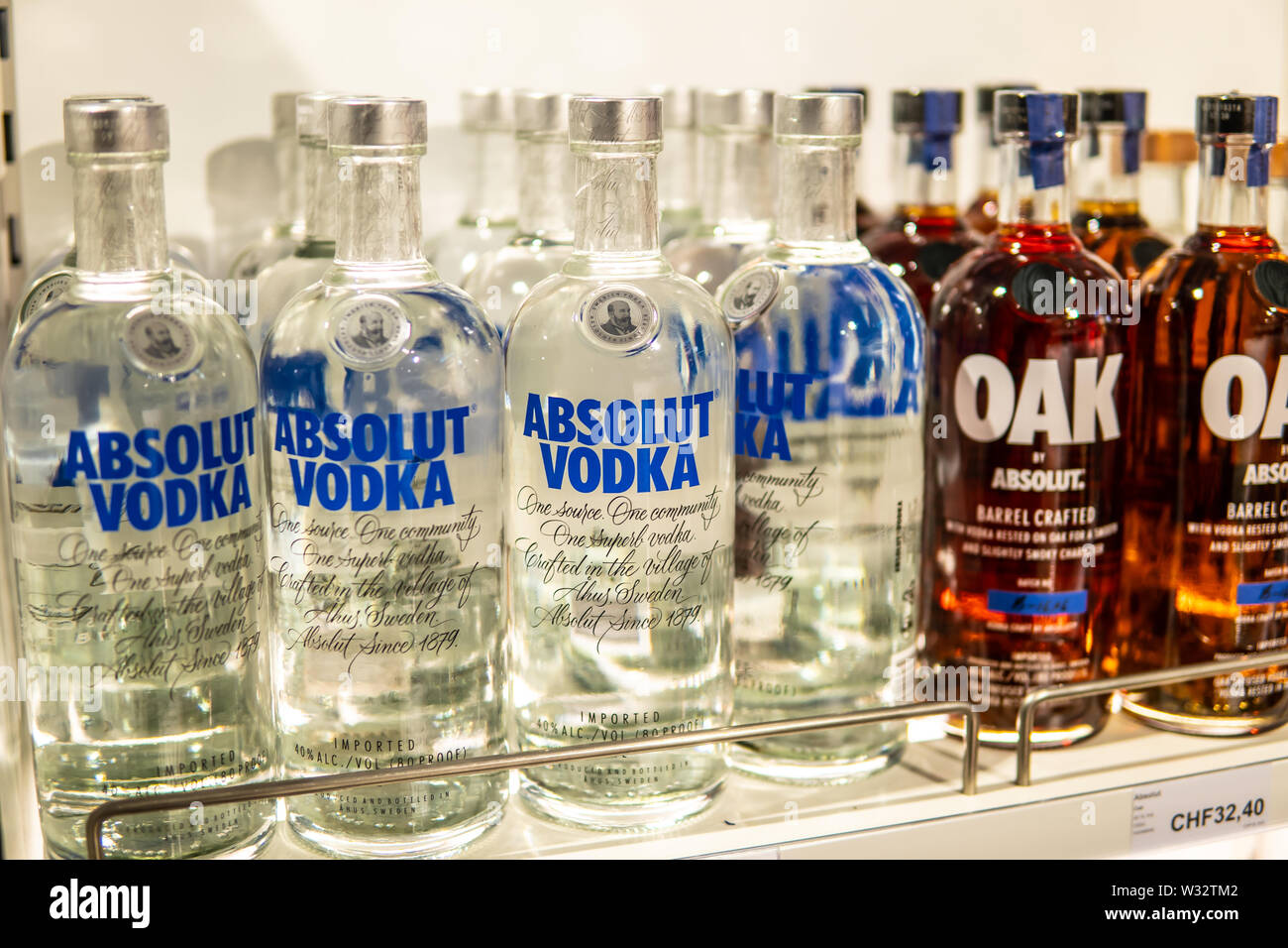 Geneva, March 2019 Bottles of Absolut Vodka on display for sale, brand of vodka produced in Sweden. Owned by Pernod Ricard brand of alcoholic spirits Stock Photo