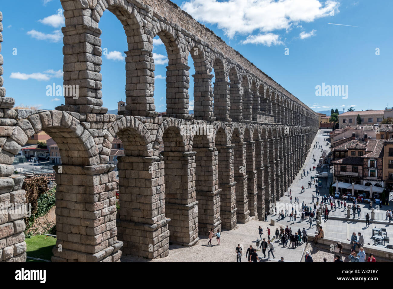 The Aqueduct of Segovia is a Roman aqueduct in Segovia, Spain. It is one of the best-preserved elevated Roman aqueducts Stock Photo