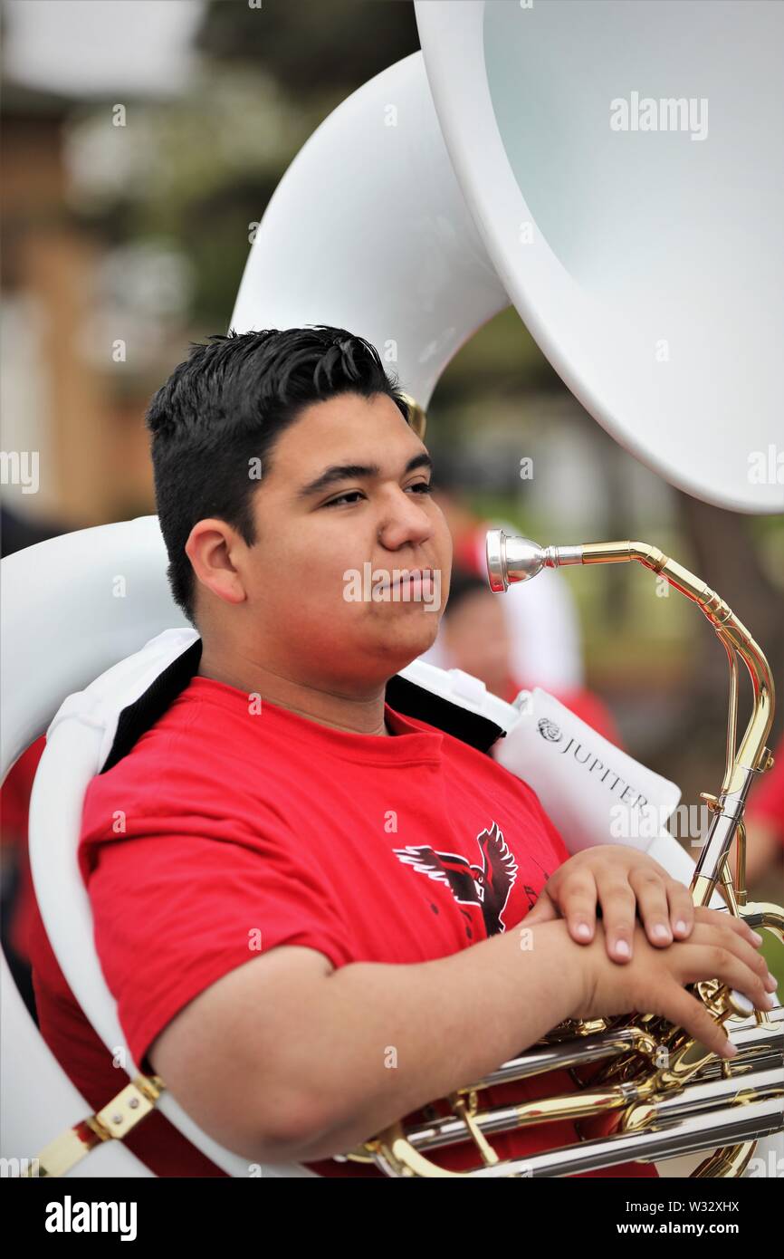 Kids in marching bands in California USA some Latinxs, Mexican, Caucasian, teens cowboy hats uniforms faces, music learning Stock Photo