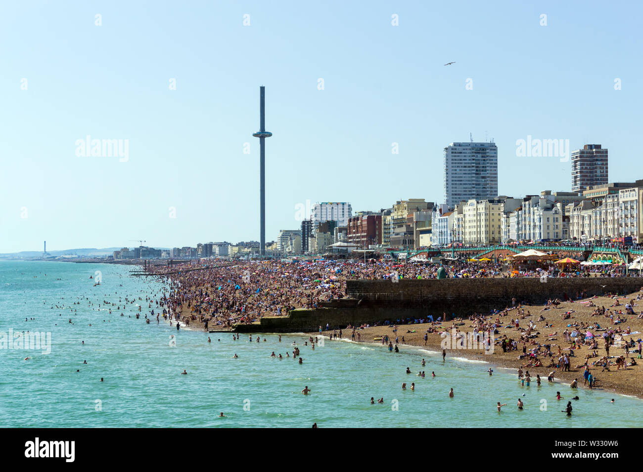 UK June 29th, 2019 Brighton beach, Brighton and Hove, East Sussex, England. Thousands of people relax on the sun. Stock Photo