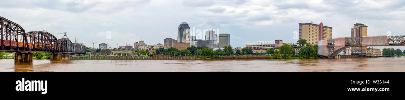 Shreveport, city in the state of Louisiana, United States, as seen across the Red River, during overcast and rain Stock Photo
