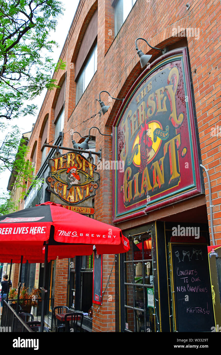 Shop signs along Front Street in the St. Lawrence Market section of Toronto Stock Photo