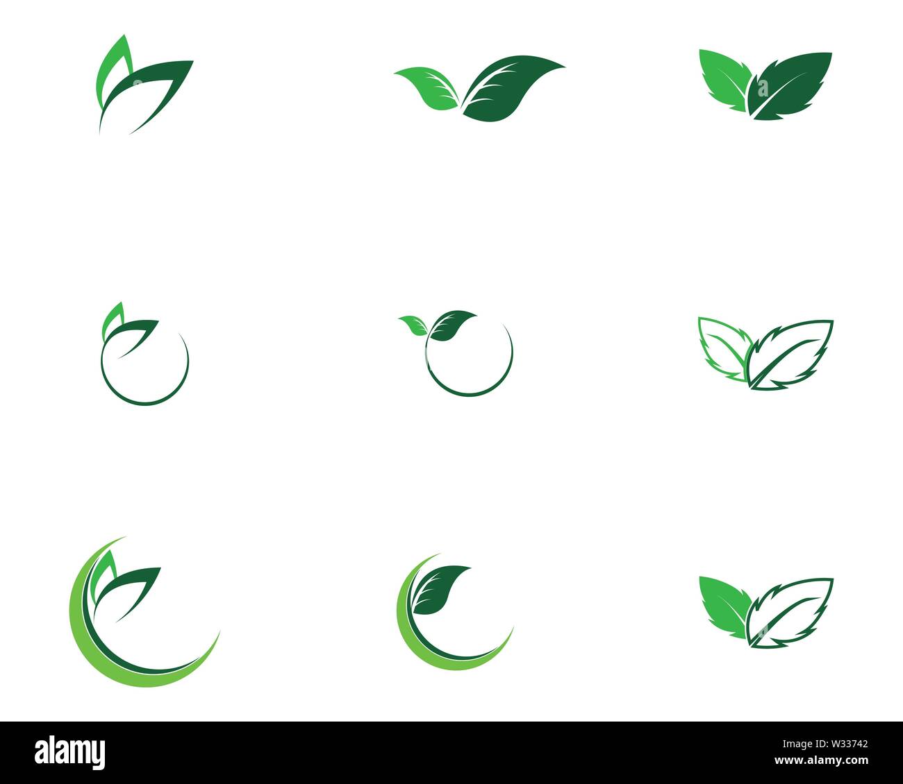 Logos of green Tree leaf ecology nature element vector Stock Photo - Alamy