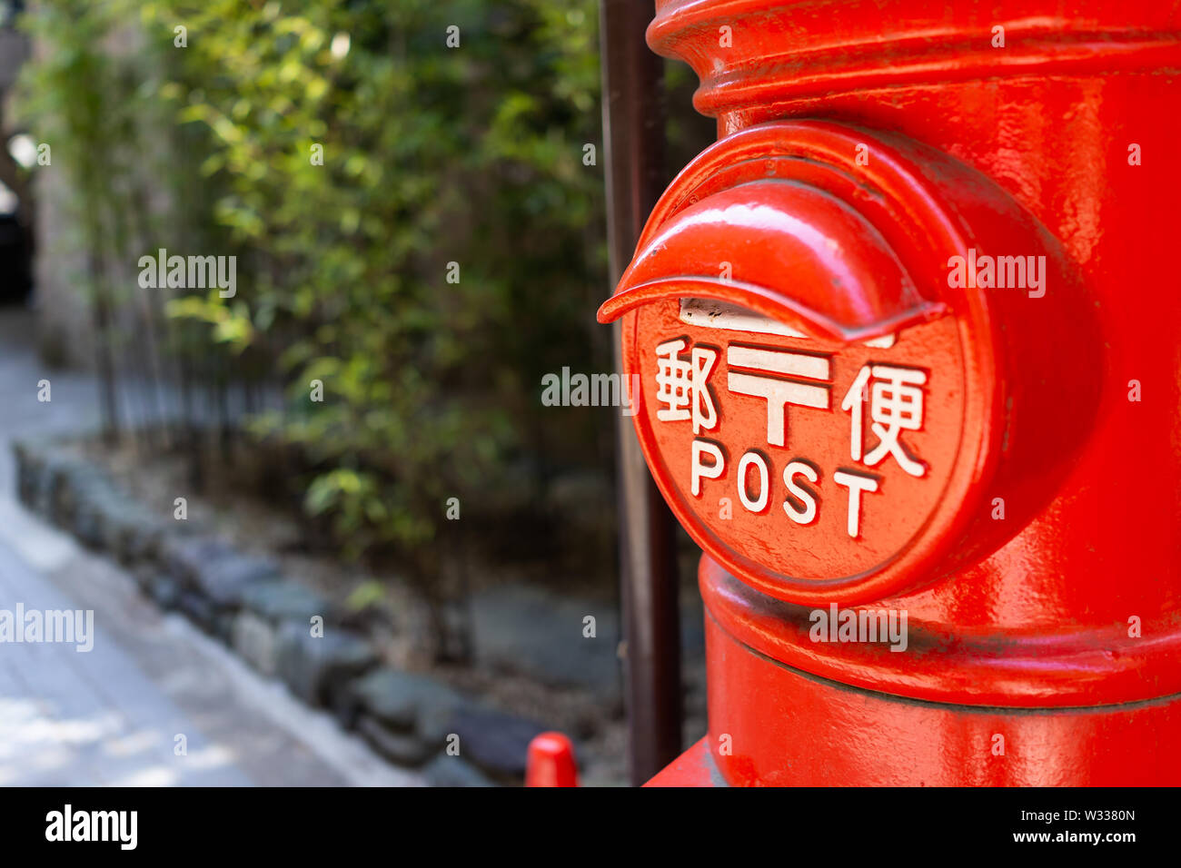 Nikko, Japan - April 4, 2019: Japan Post service mailbox painted in red in Japanese city or town of Tochigi prefecture Stock Photo