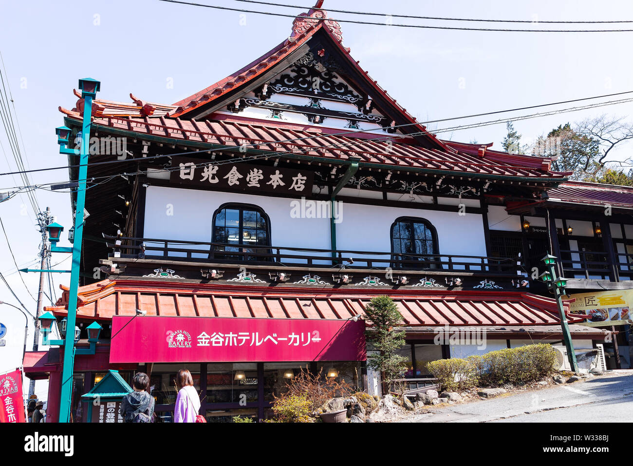 Nikko, Japan - April 4, 2019: Famous Kanaya hotel made in traditional wooden Japanese style design on street with people in Tochigi prefecture Stock Photo