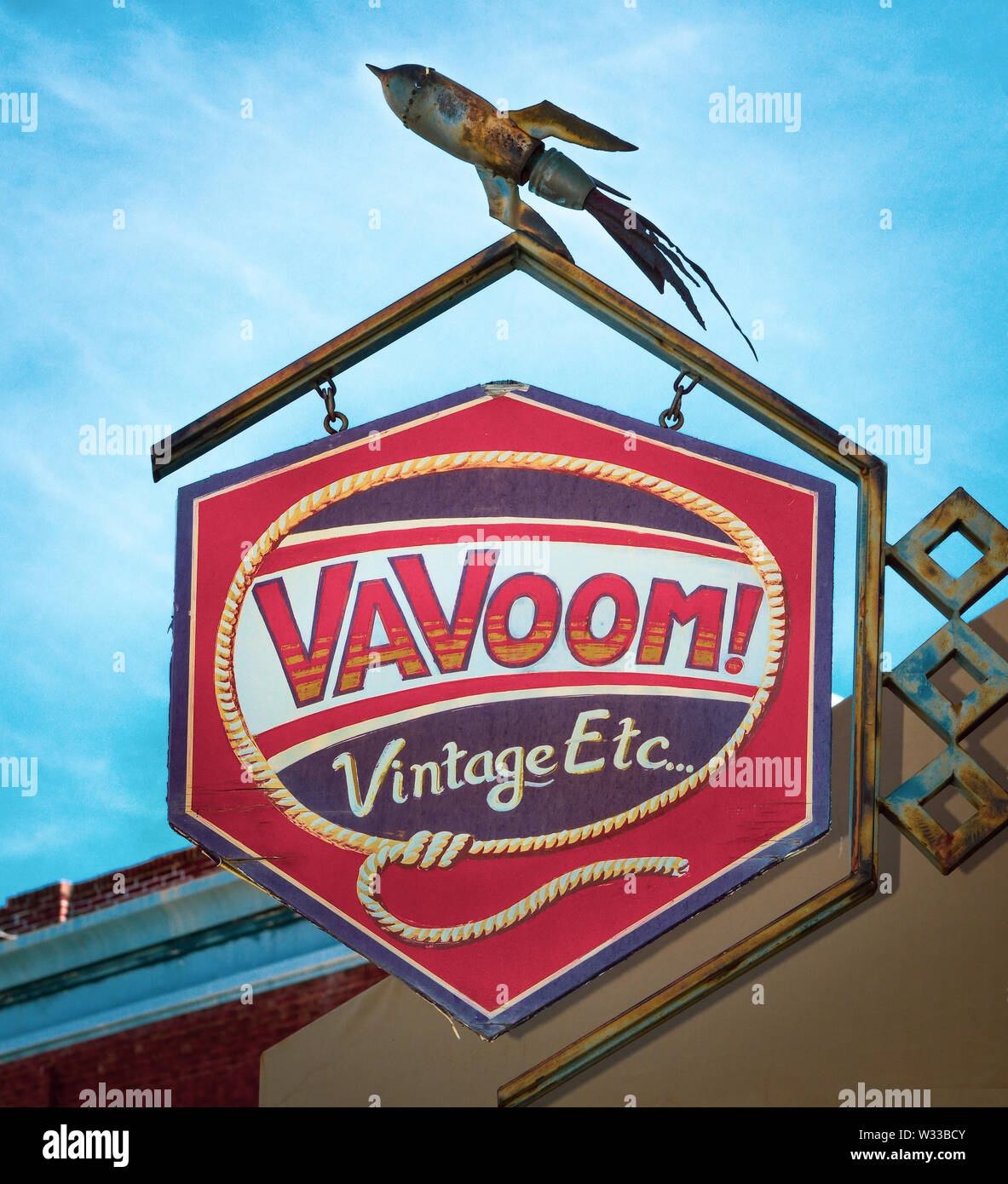 The VaVoom's colorful overhead store sign which includes an old rusty rocket ship on the frame, a unique antique and vintage shop, Bisbee, AZ, USA Stock Photo
