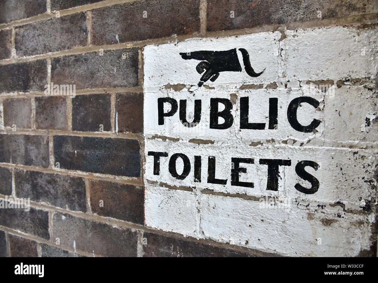 public toilet sign done in classic old style in glen innes in noerthern new south wales, australia Stock Photo