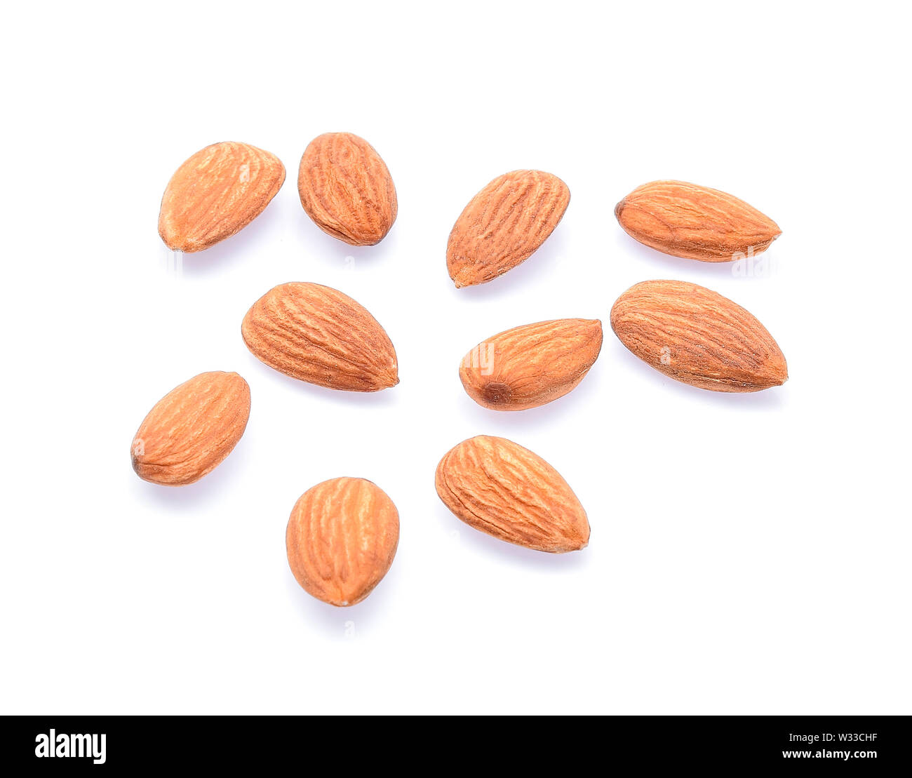 Almonds isolated on white background Stock Photo - Alamy