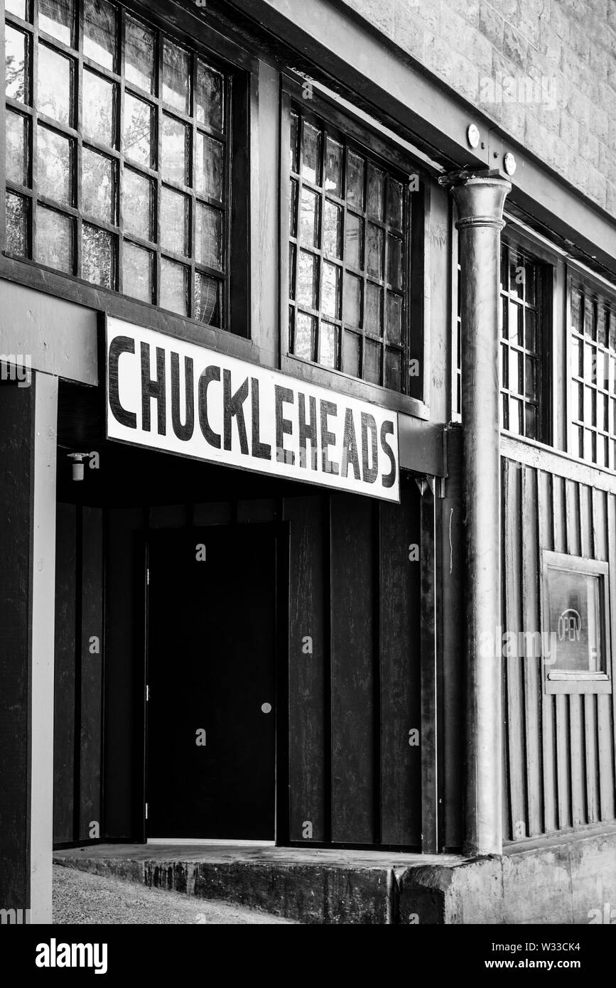 Entrance to Chuckleheads, a comedy club in the historic mining town of Bisbee, AZ, in black and white Stock Photo
