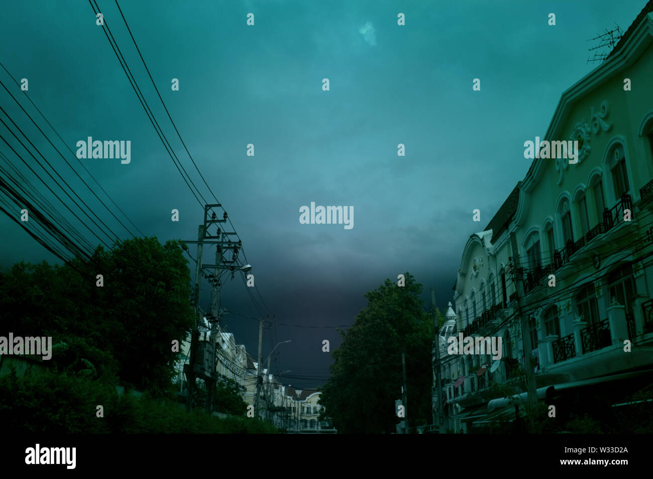 Electric cable lines with blue sky background Stock Photo - Alamy