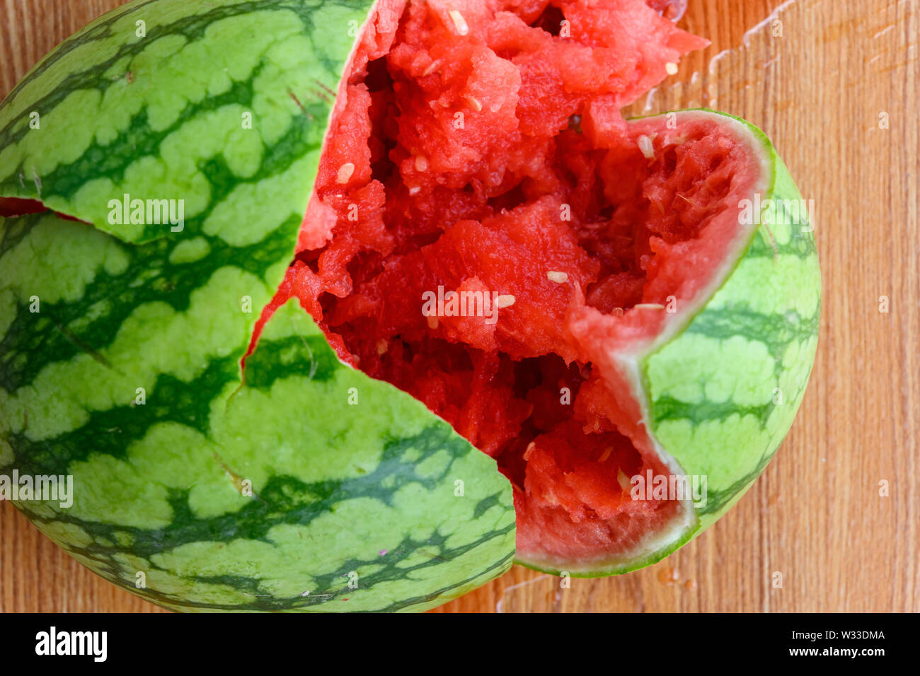 top view smashed watermelon close up on the ground Stock Photo - Alamy
