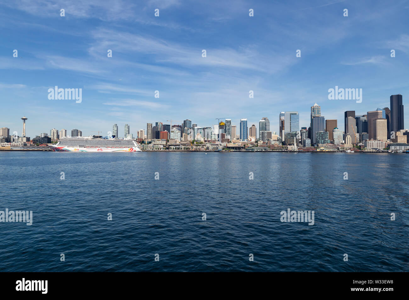 United States of America, USA, Washington, Seattle, 11th of May 2019. View from a ferry across Puget Sound on the city skyline and a cruise ship Stock Photo