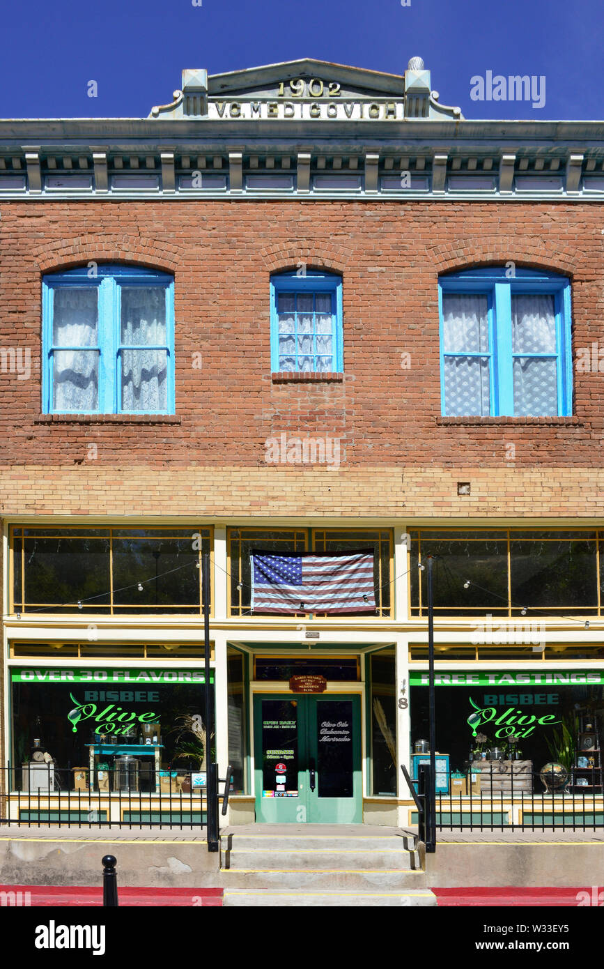 The historic brick building and storefront entrance to the Bisbee Olive