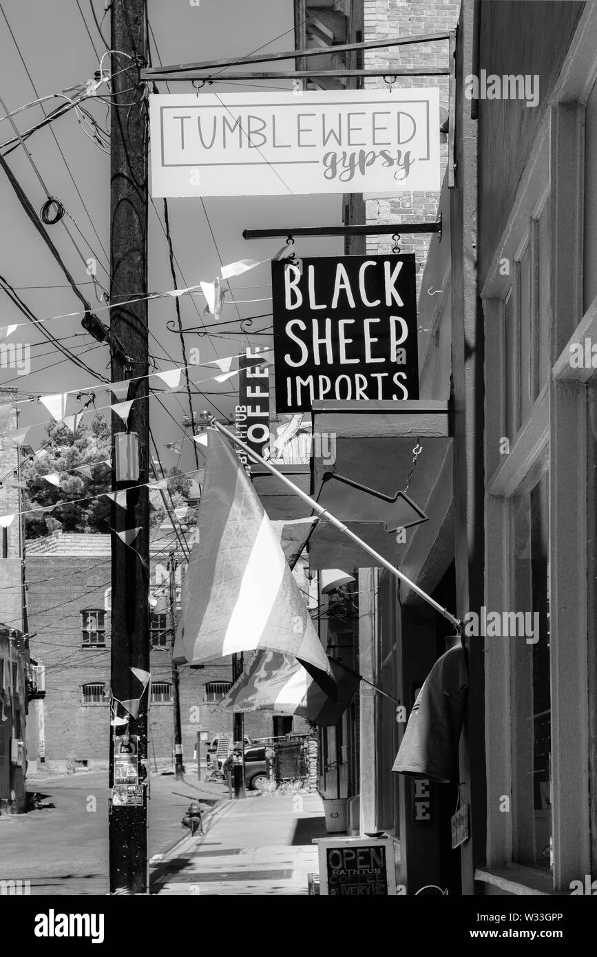 A sidewalk lined with storefronts for shopping and eating and sightseeing in the historic old mining small town of America, Bisbee, AZ, Stock Photo