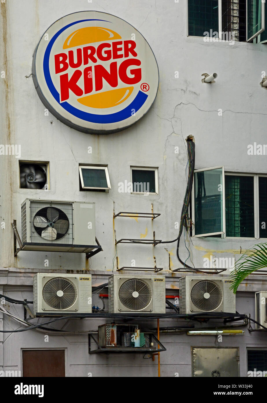 kuala lumpur, malaysia - december 21, 2014: rear facade of a burger king restaurant with logo and air conditioning units on jalan benteng Stock Photo