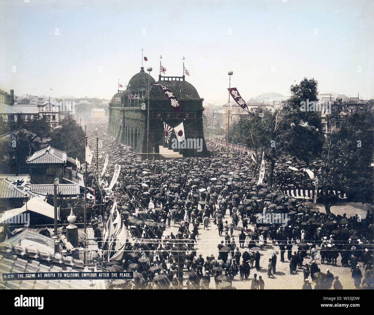 [ 1890s Japan - Welcome Ceremony for Japanese Emperor ] —   The triumphal arch made in Tokyo's Hibiya district to welcome Emperor Meiji back to the capital after the conclusion of the First Sino-Japanese War (1894–1895). This shows the scene on May 30, 1895 (Meiji 28) when hundreds of thousands of people had taken to the street for the Emperor's Welcome Ceremony.  19th century vintage albumen photograph. Stock Photo