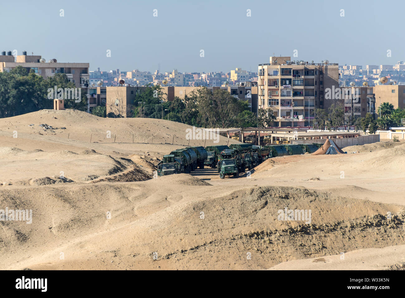 Ismailia, Egypt - November 5, 2017: Military all terrain trucks with an item for a pontoon bridge for crossing the Suez Canal on the shore of canal ne Stock Photo
