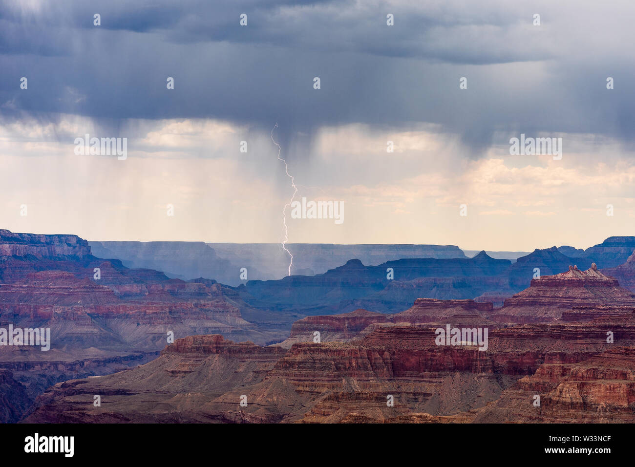 Lightning strikes from a storm moving across the Grand Canyon as viewed from Navajo Point, Grand Canyon National Park, Arizona, USA Stock Photo