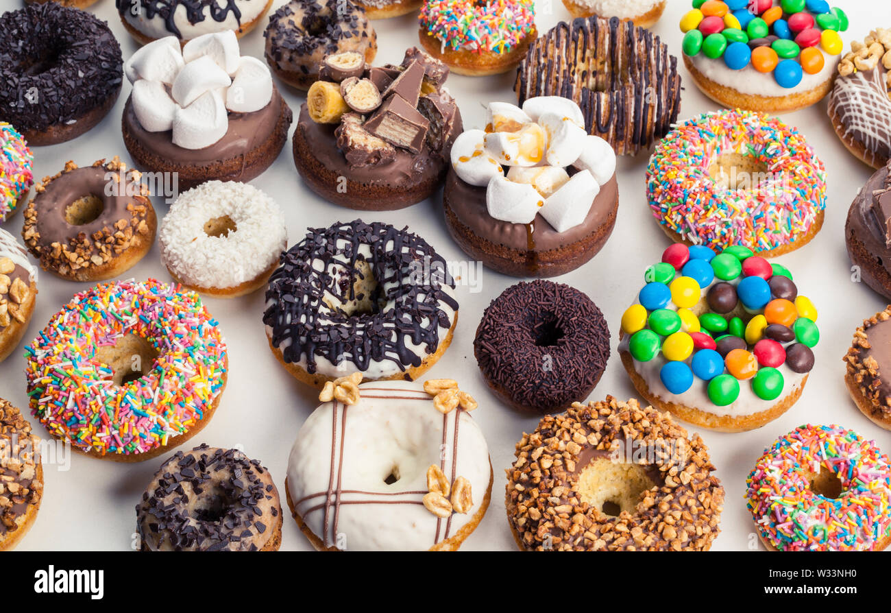 Close up of a selection of colorful donuts Stock Photo - Alamy