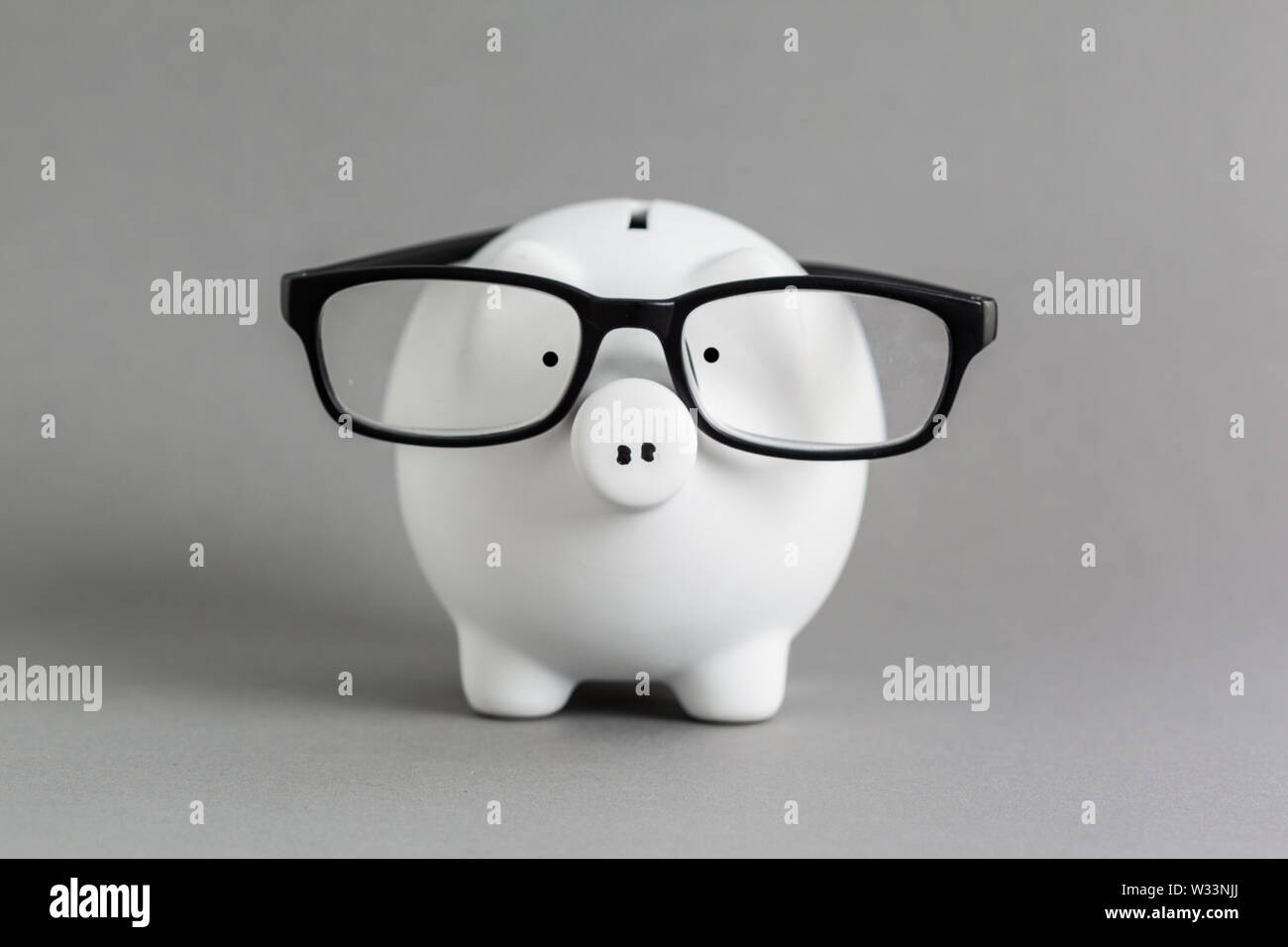 pink ceramic piggy bank over a grey background Stock Photo - Alamy