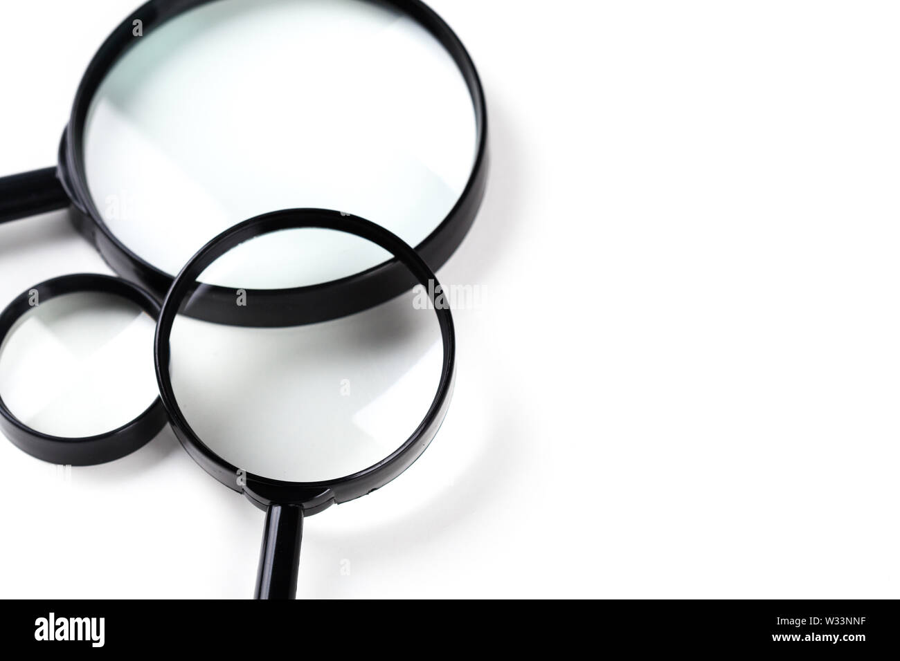 Three magnifiers over white Stock Photo Alamy