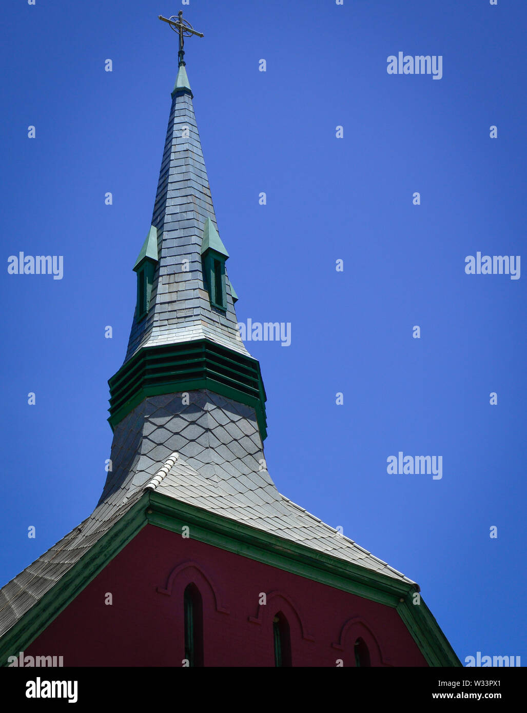 Close up of The impressive Convenant Presbyterian Church with it's red brick and tall steeple in the old mining town of Bisbee, AZ, USA Stock Photo