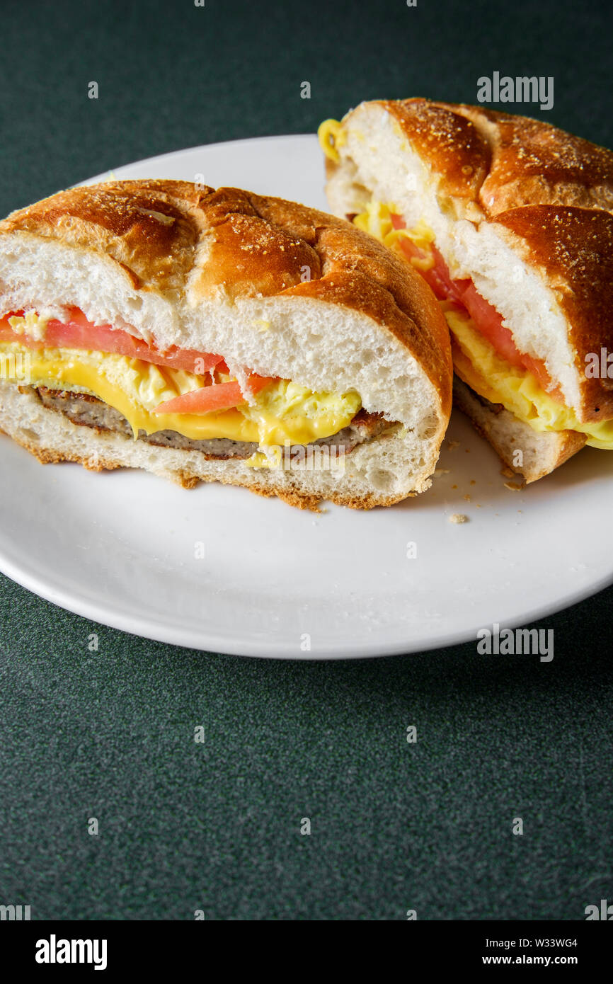 Sausage egg and cheese breakfast sandwich with tomato Stock Photo