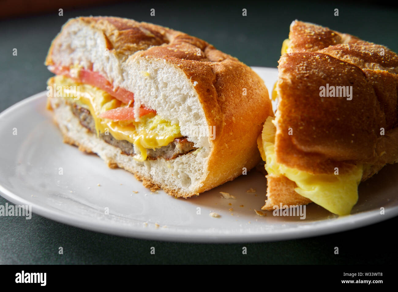 Sausage egg and cheese breakfast sandwich with tomato Stock Photo Alamy