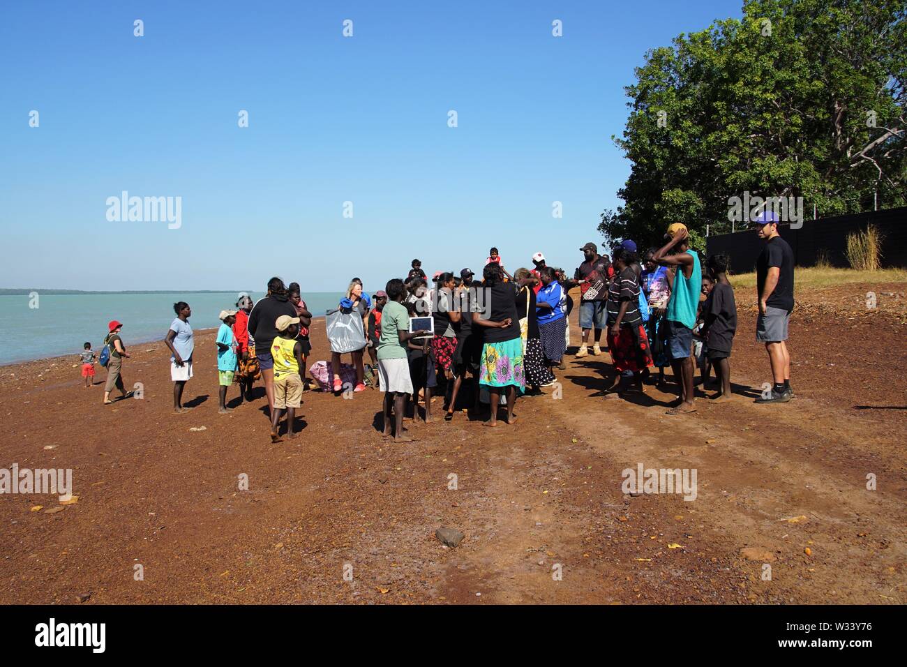 Large Group of People assembled on a Tiwi Islands Beach prior to a ...