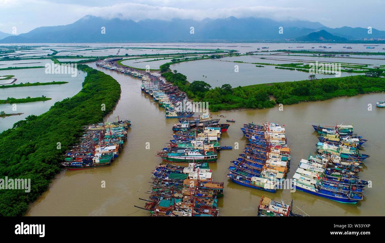(190712) -- BEIJING, July 12, 2019 (Xinhua) -- Aerial photo taken on Aug. 14, 2018 shows vessels anchoring at Hengshan fishing port in Jiangmen, south China's Guangdong Province. Located in south China, Guangdong Province faces the South China Sea and borders Hunan and Jiangxi provinces to the north. It boasts the well-known Pearl River Delta, which is composed of three upstream rivers and a large number of islands. Due to the climate, Guangdong is famous for a diversified ecological system and environment. In recent years, by upholding the principle of green development, Guangdong has made Stock Photo