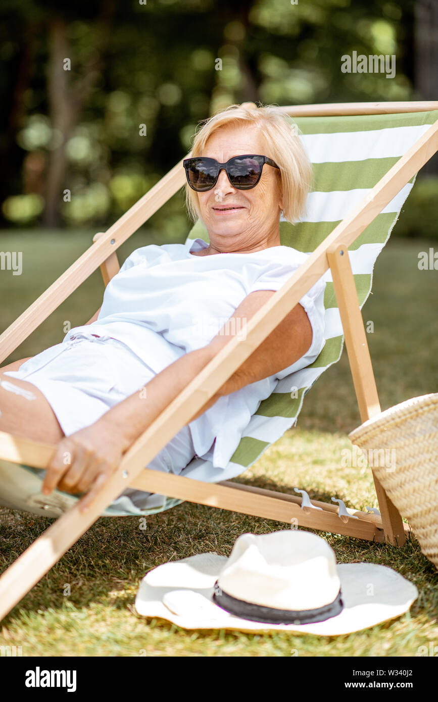 Carefree Mature Woman Sunbathing High Resolution Stock Photography and ...
