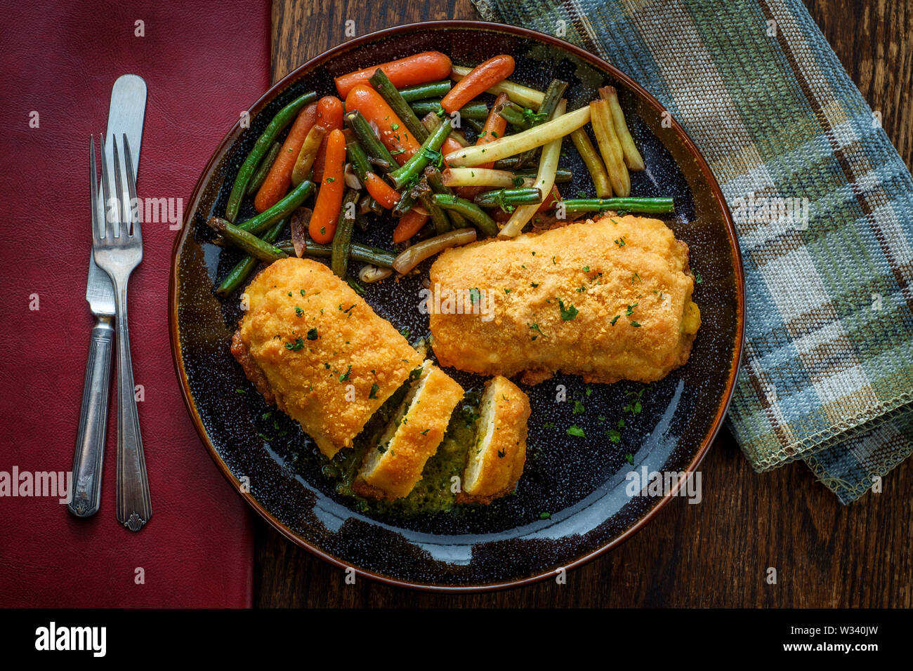 Russian cuisine stuffed chicken cutlets kievstyle with butter sauce