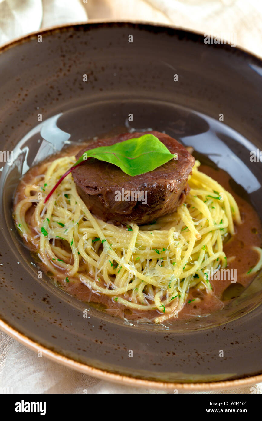 grilled beef fillet pieces on noodles Stock Photo Alamy