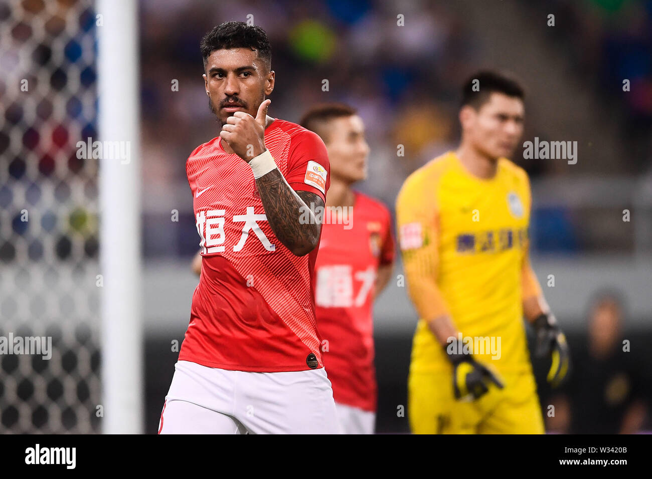 Brazilian football player Paulinho of Guangzhou Evergrande Taobao reacts as he competes against Tianjin TEDA in their 17th round match during the 2019 Chinese Football Association Super League (CSL) in Tianjin, China, 11 July 2019. Guangzhou Evergrande Taobao defeated Tianjin TEDA 3-0. Stock Photo