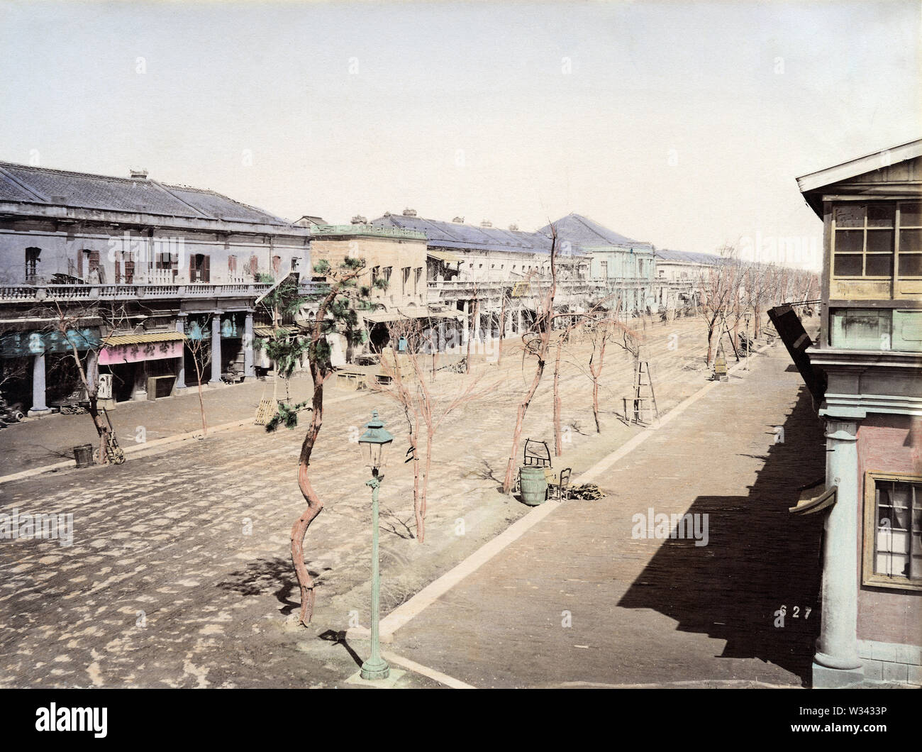[ 1870s Japan - Street View of Ginza, Tokyo ] —   Ginza, ca. 1873. Fires destroyed Ginza in 1872, prompting the Tokyo Government to contract Irish architect Thomas J. Waters to design fire-resistant Western style buildings. When the multi-year plan was completed in 1877 (Meiji 10), Ginza became Tokyo’s trendiest shopping avenue.  19th century vintage albumen photograph. Stock Photo