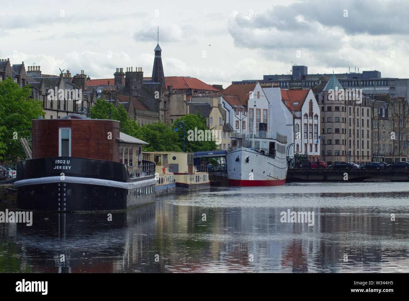 Edinburgh, Scotland / UK : May 26 2019: Barges are docked in area of Leith, Edinburgh, called the 'Shore'. Stock Photo