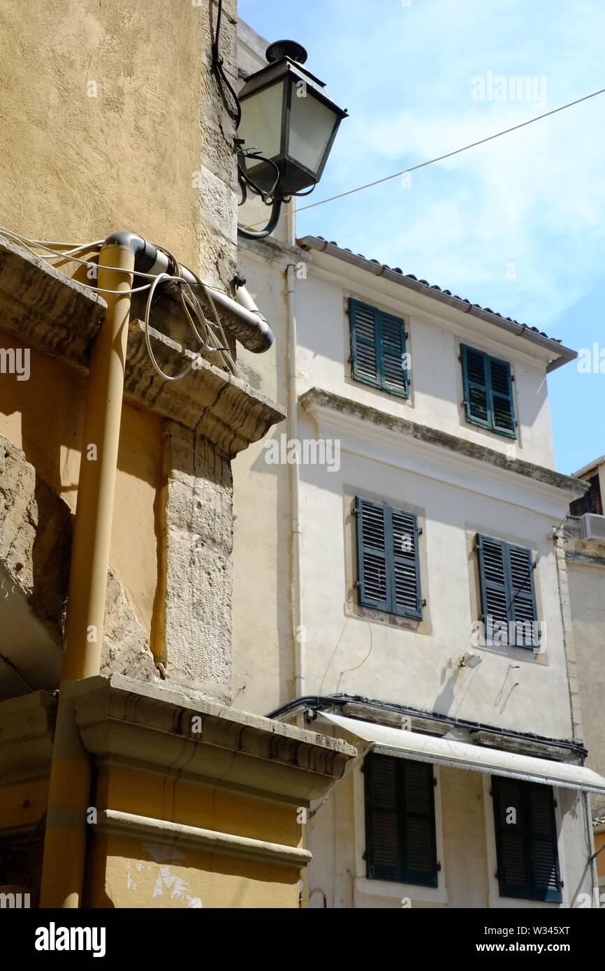 Corfu Corfu town here is another example of the architecture style you find.the town is a maze of narrow streets and buildings like this. Stock Photo