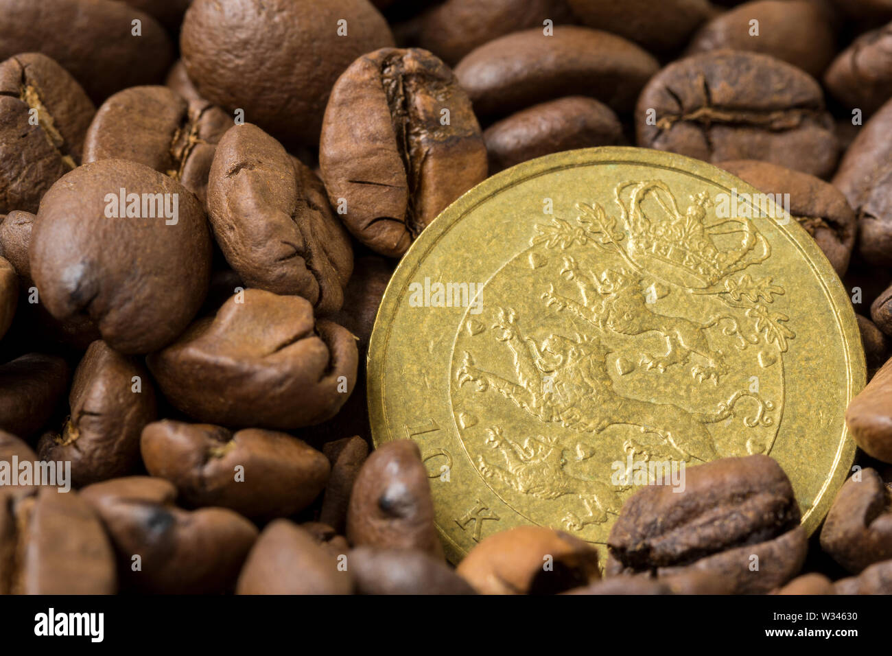 Danish coffee market. Roasted coffee beans and 10 danish krone coin Stock Photo