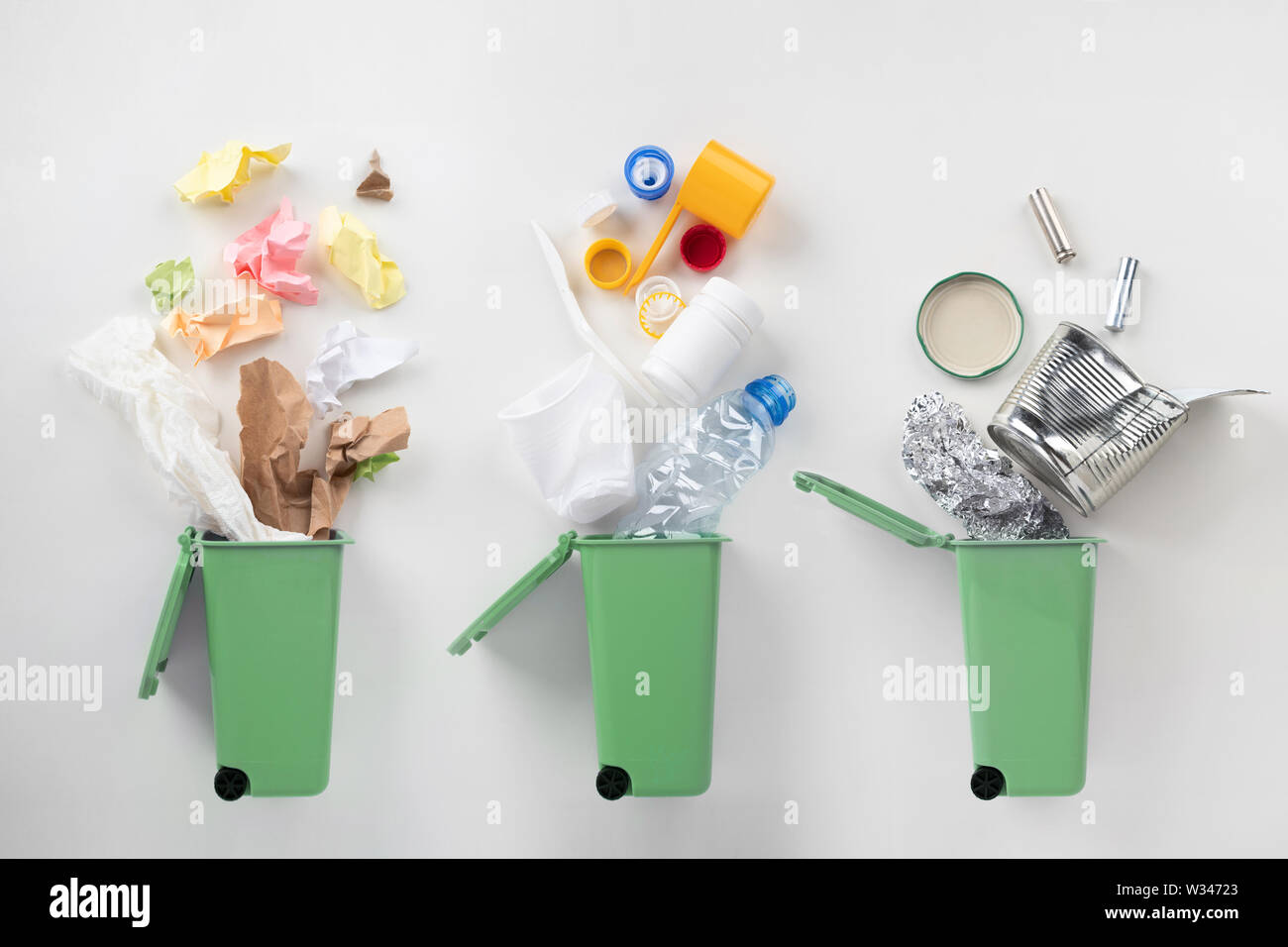 top view of trash bins and sorted garbage on grey Stock Photo
