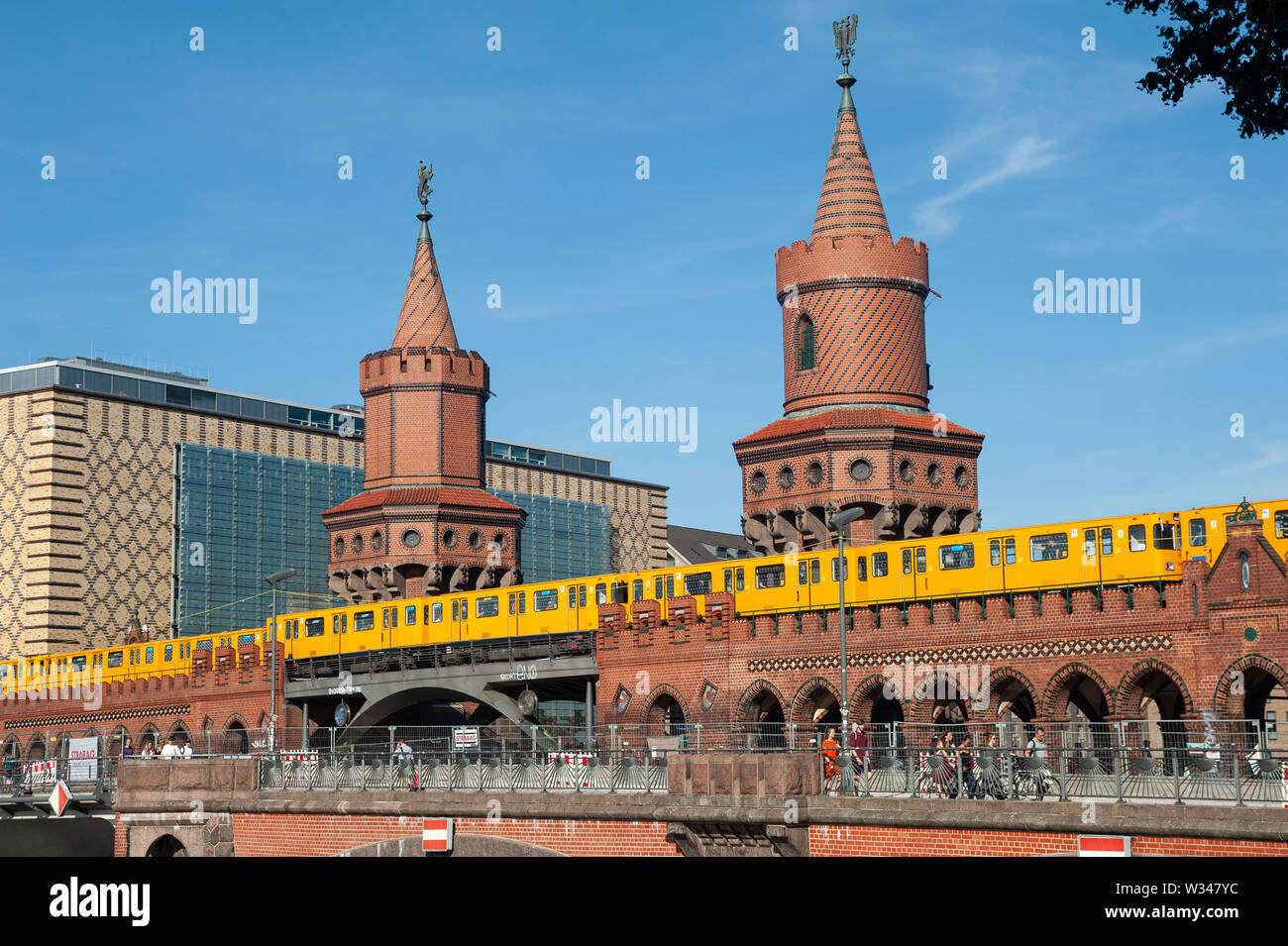 24.06.2019, Berlin, Germany, Europe - A subway traverses the Oberbaum Bridge that connects the districts of Kreuzberg and Friedrichshain. Stock Photo