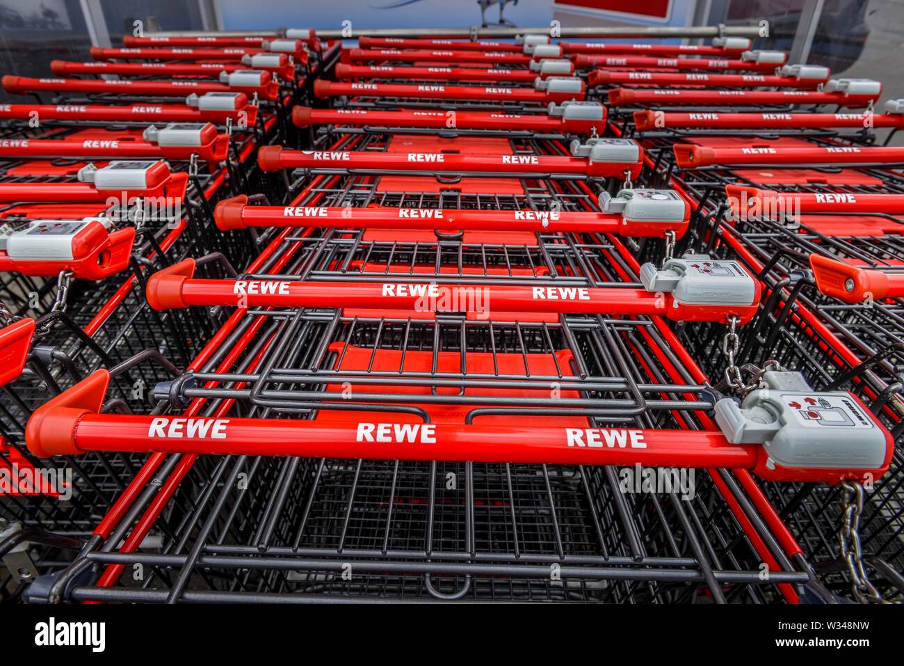 Shopping trolleys pushed together hires stock photography and images