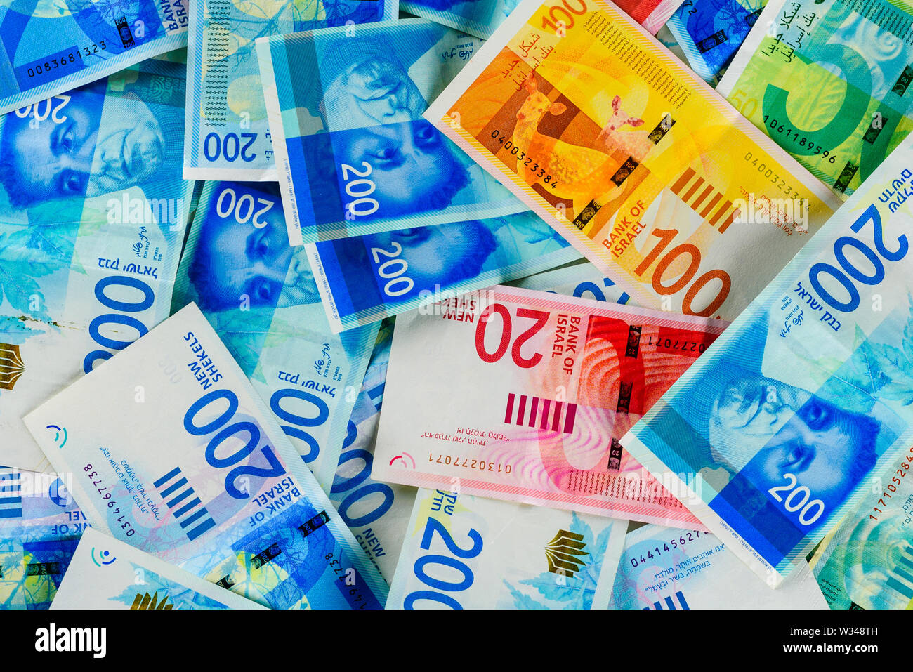 Stack of various Israeli shekel bills. Israel money banknotes of 50, 20