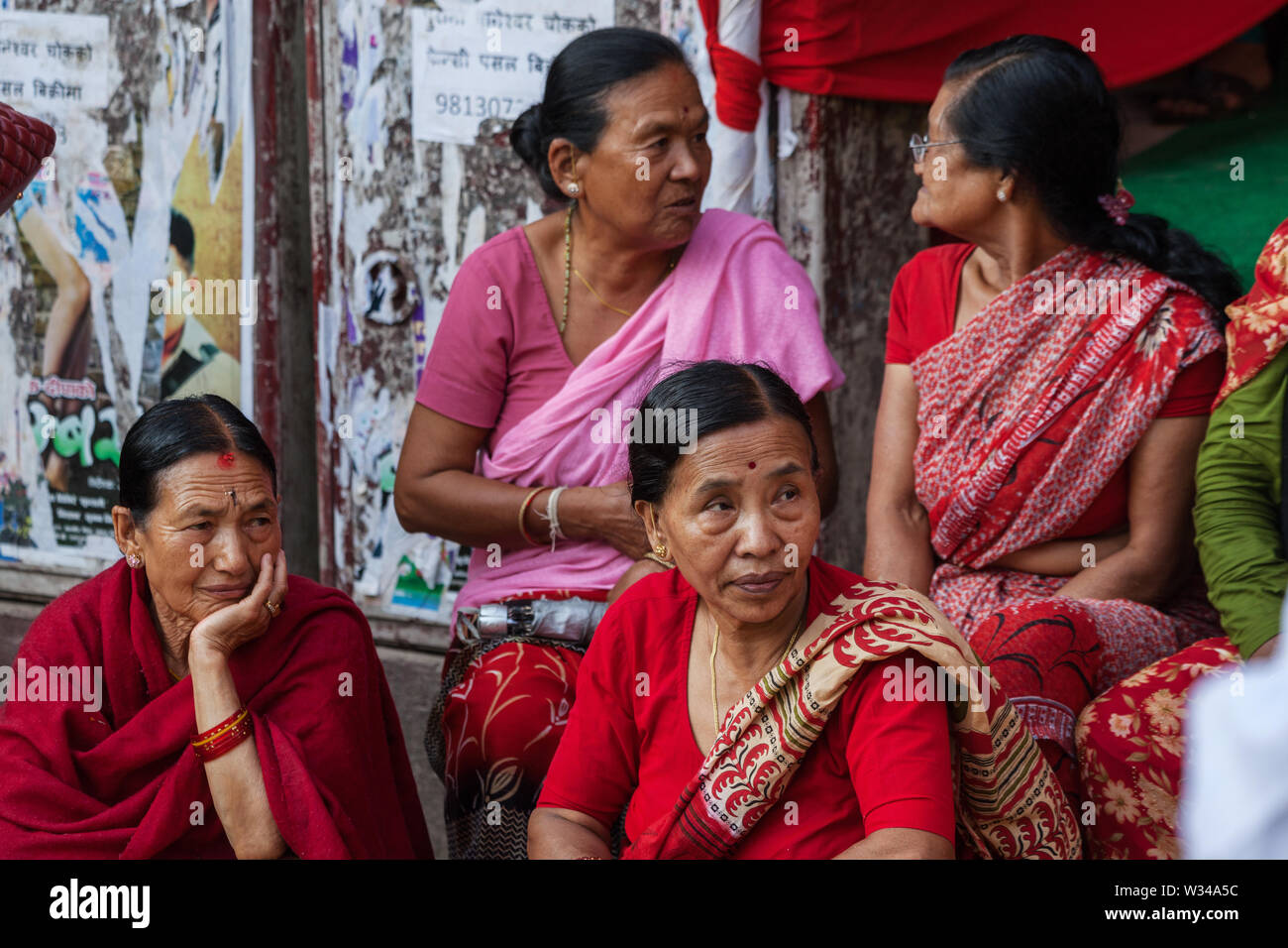 Women gathered on a street in Kathmandu Stock Photo