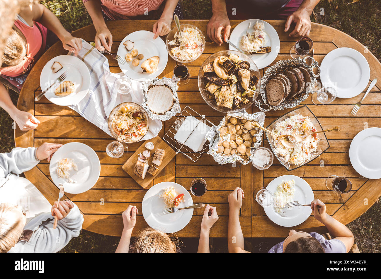 People eat at the table Stock Photo Alamy