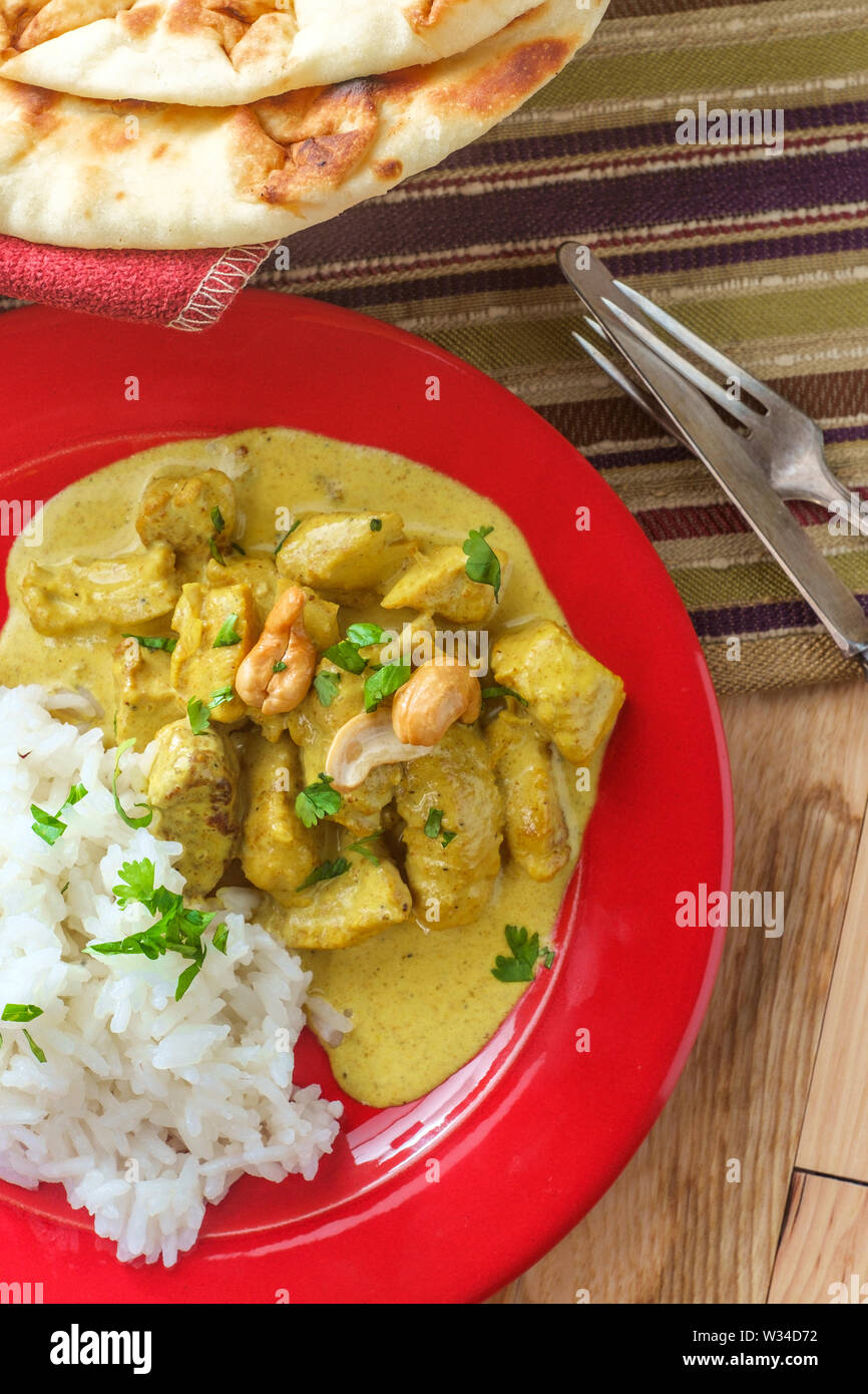 Authentic Indian chicken korma curry with jasmine rice Stock Photo Alamy