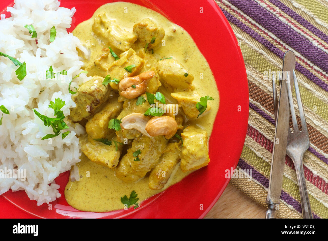 Authentic Indian chicken korma curry with jasmine rice Stock Photo Alamy