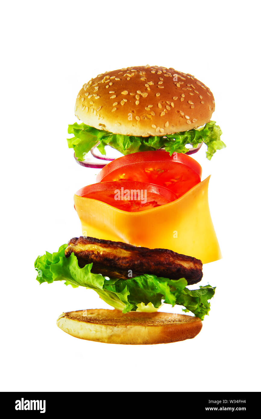 Flying ingredients for a homemade burger. Not diet food, unhealthy food