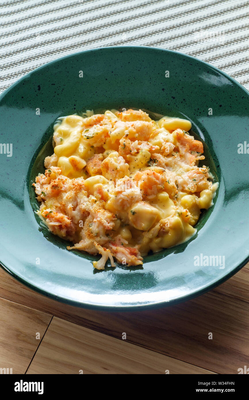 Delicious baked breaded lobster macaroni and cheddar cheese Stock Photo