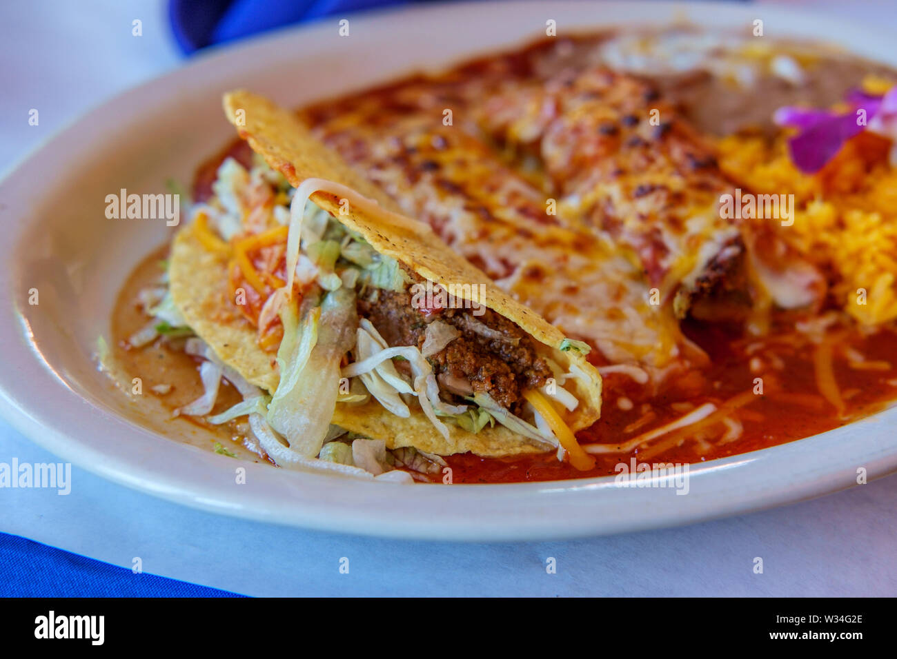 Authentic Mexican tamale cheese enchilada and beef taco dinner with