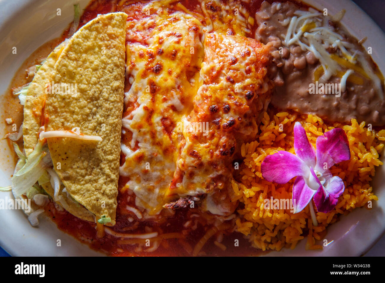 Authentic Mexican tamale cheese enchilada and beef taco dinner with